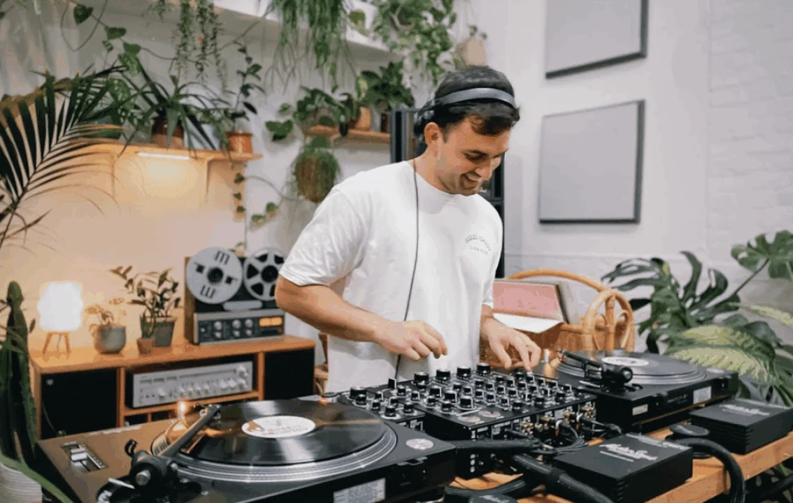 DJ Tim Garcia, the music curator partnered with Salsa Shop through Kollekt.fm, standing in the restaurant during the launch of the new Salsa Shop soundtrack.